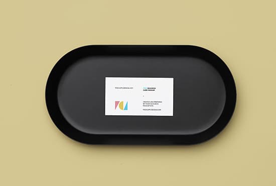 Business card on a black plate mockup