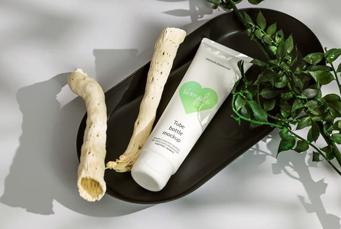 Cosmetic tube in black tray mockup