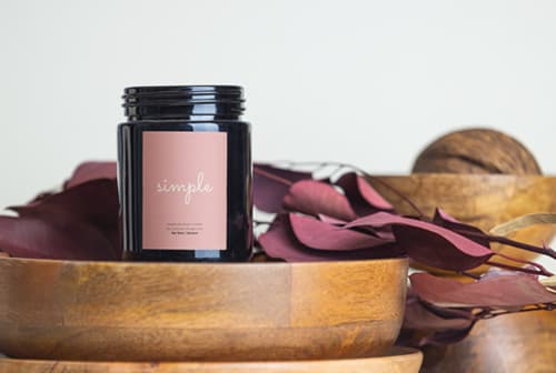 Dark candle with decorative elements mockup