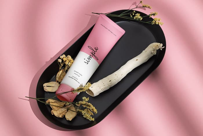 Cosmetic tube on black tray mockup