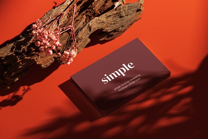 Business card on red background mockup