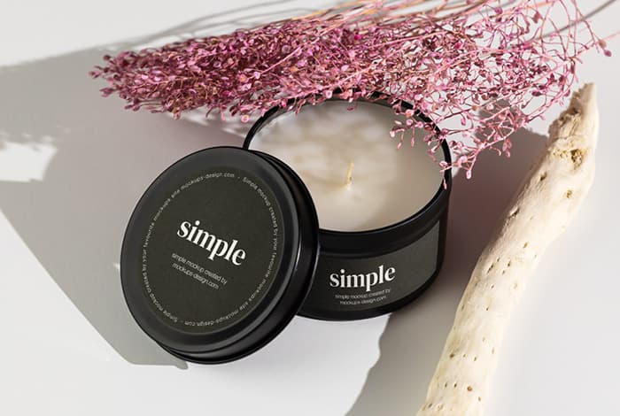 Candle in tin jar on light background mockup