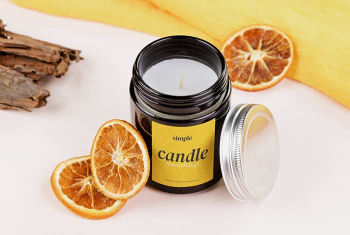Candle with dried oranges mockup