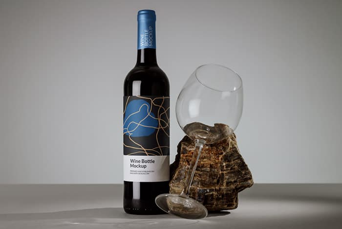 Wine bottle with a glass mockup