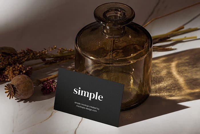 Business card with marble and bottle mockup